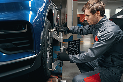 Mechanic doing wheel alignment